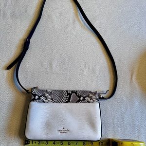 Kate Spade crossbody bag in cream and snake print .